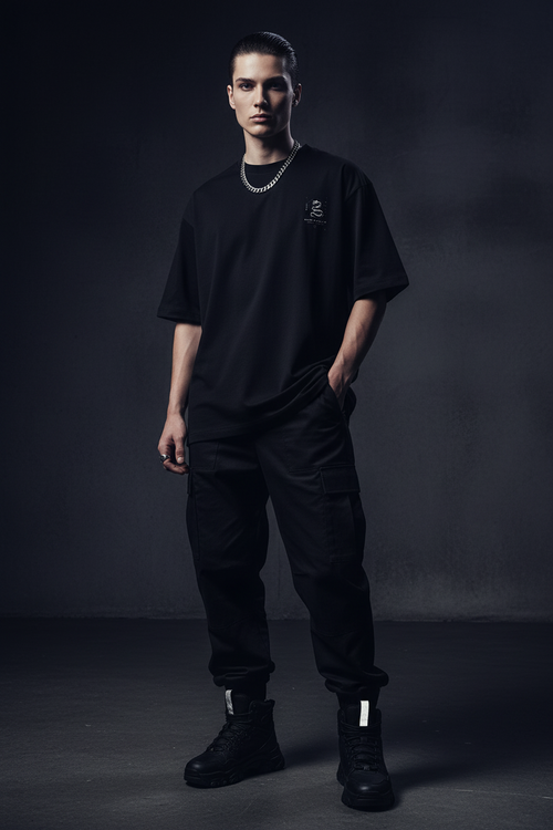 Model wearing Unisex Oversized Standard T-Shirt in black with snake graphic